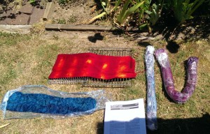 Handpainted scarves and roving heated in plastic wrap