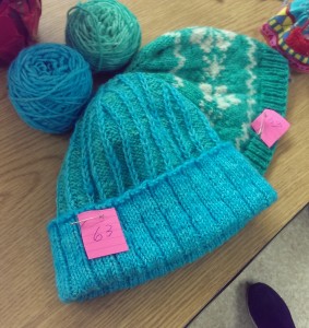 A pair of green and blue hats.